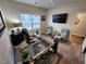 Bright home office with a glass desk, three armchairs, and a large window at 400 Access Dr, Youngsville, NC 27596