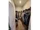 Walk-in closet with ample shelving and hanging space, great for organizing clothes and accessories at 400 Access Dr, Youngsville, NC 27596