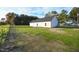 Expansive backyard with lush green grass and a freshly paved patio provides the perfect space for outdoor enjoyment at 400 S Eastwood Dr, Benson, NC 27504