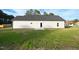 Expansive backyard with lush green grass and a freshly paved patio provides the perfect space for outdoor enjoyment at 400 S Eastwood Dr, Benson, NC 27504