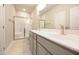 Modern bathroom featuring a double vanity, white countertop, and glass-enclosed shower at 400 S Eastwood Dr, Benson, NC 27504