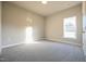 Bright bedroom with neutral walls and carpet at 400 S Eastwood Dr, Benson, NC 27504