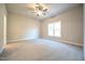 Spacious bedroom with neutral carpet, a large window, and ample natural light at 400 S Eastwood Dr, Benson, NC 27504