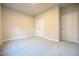 Neutral bedroom with plush carpet features a double door closet and a large window providing plenty of natural light at 400 S Eastwood Dr, Benson, NC 27504