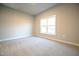 Comfortable bedroom featuring natural light and carpeting at 400 S Eastwood Dr, Benson, NC 27504