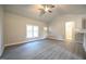 Sunlit living space with stylish flooring, offering a blank canvas for your dream home design at 400 S Eastwood Dr, Benson, NC 27504