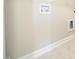 Laundry hookups feature white trim and neutral paint color at 400 S Eastwood Dr, Benson, NC 27504