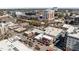 Aerial view of a neighborhood with a mix of residential and commercial buildings and visible streets at 400 W North St # 900, Raleigh, NC 27603