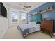 Bright bedroom features stylish decor, city views, and comfortable modern furnishings at 400 W North St # 900, Raleigh, NC 27603