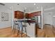 Modern kitchen with stainless steel appliances, dark granite countertops, and a breakfast bar at 400 W North St # 900, Raleigh, NC 27603
