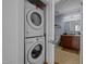 Convenient laundry area next to a well-appointed bathroom with granite countertops at 400 W North St # 900, Raleigh, NC 27603