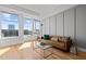 Bright living room with hardwood floors, modern decor, and large windows with city views at 400 W North St # 900, Raleigh, NC 27603