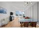 Inviting living room with hardwood floors, contemporary lighting, and expansive windows with city views at 400 W North St # 900, Raleigh, NC 27603