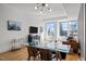 Open-concept living space with hardwood floors, city views, and modern furnishings at 400 W North St # 900, Raleigh, NC 27603