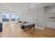 Bright living room with hardwood floors, modern lighting, and large windows with city views at 400 W North St # 900, Raleigh, NC 27603