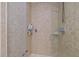 Tiled walk-in shower features multiple showerheads and built-in shelving at 400 W North St # 900, Raleigh, NC 27603