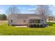Backyard featuring a well-maintained lawn, covered porch, and a patio at 42 Galaxy Dr, Garner, NC 27529