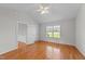 Spacious bedroom with wood floors, featuring large windows and doorways, providing ample natural light at 42 Galaxy Dr, Garner, NC 27529