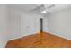 Bedroom with wood floors, ceiling fan, and double door closet at 42 Galaxy Dr, Garner, NC 27529