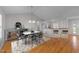 Bright dining room features a modern chandelier and a marble-top table adjacent to the beautiful kitchen at 42 Galaxy Dr, Garner, NC 27529