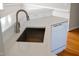 Modern kitchen featuring stainless sink, dishwasher, and quartz countertop at 42 Galaxy Dr, Garner, NC 27529