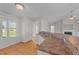 Bright kitchen with hardwood floors, generous counter space, and views of the living area at 42 Galaxy Dr, Garner, NC 27529