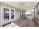 Covered screened-in porch has a ceiling fan and leads to backyard at 42 Galaxy Dr, Garner, NC 27529