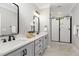 Modern bathroom with double vanity, walk-in shower, and stylish fixtures at 503 Forest Rd, Oxford, NC 27565