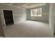 Bright bedroom featuring neutral walls, natural light, and a serene atmosphere at 503 Forest Rd, Oxford, NC 27565