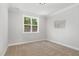 Bedroom featuring a large window, neutral walls, and carpet flooring at 503 Forest Rd, Oxford, NC 27565