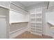 Walk-in closet with built-in shelving and rods for ample storage space at 503 Forest Rd, Oxford, NC 27565