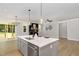 Open concept kitchen featuring an island with seating and stainless steel appliances at 503 Forest Rd, Oxford, NC 27565