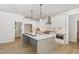 Spacious kitchen with a large island, pendant lighting, and stainless steel appliances at 503 Forest Rd, Oxford, NC 27565