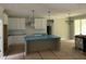 Newly constructed kitchen featuring an island, white cabinets, and modern lighting at 503 Forest Rd, Oxford, NC 27565