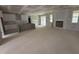 Open concept living room with a view of the kitchen, island, and backyard at 503 Forest Rd, Oxford, NC 27565
