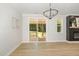 Bright living area with sliding doors to the screened porch, natural light, and a cozy fireplace, enhancing indoor-outdoor living at 503 Forest Rd, Oxford, NC 27565