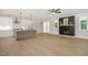 An airy open-concept living area boasts hardwood floors, a modern kitchen, and a sleek fireplace, blending style and functionality at 503 Forest Rd, Oxford, NC 27565