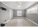 A light filled bedroom with laminate flooring and a closet at 510 Cross St, Sanford, NC 27330