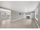 Bright living room showcasing hardwood floors, a fireplace, built-in shelving, and plenty of natural light at 510 Cross St, Sanford, NC 27330