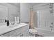 Bright bathroom with a modern vanity, a shower-tub combo, and a neutral color palette at 5813 Empathy Ln, Raleigh, NC 27616
