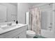 Well-lit bathroom with a shower-tub combo and stylish vanity at 5813 Empathy Ln, Raleigh, NC 27616
