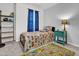 Bedroom with a kid-friendly transport-themed bed, blue curtains, and a colorful rug at 5813 Empathy Ln, Raleigh, NC 27616