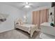 bedroom features a twin bed with a detailed headboard and light pink curtains at 5813 Empathy Ln, Raleigh, NC 27616