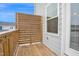 Balcony/deck with wood floor and wood panel privacy screen at 5813 Empathy Ln, Raleigh, NC 27616