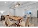 Dining room with wood table and views of the kitchen at 5813 Empathy Ln, Raleigh, NC 27616