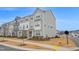 Attractive townhome showcasing light gray siding and manicured landscaping at 5813 Empathy Ln, Raleigh, NC 27616
