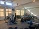 A well equipped gym with multiple weight machines, mirrored walls, and high ceilings at 5813 Empathy Ln, Raleigh, NC 27616
