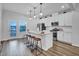 Modern kitchen featuring white cabinetry, stainless steel appliances, and a stylish island at 5813 Empathy Ln, Raleigh, NC 27616