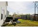 Spacious backyard with furniture, a grill, and a trampoline at 612 Marian Way, Sanford, NC 27330