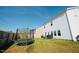 Large backyard with a grill, trampoline, and green grass at 612 Marian Way, Sanford, NC 27330